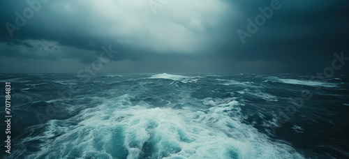 Stormy ocean waves under dark dramatic sky. Nature's power and oceanography.