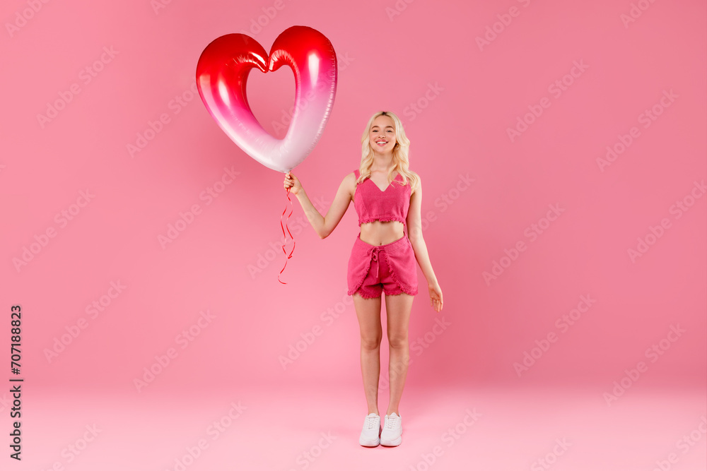 Radiant girl with a big heart balloon, all pink Radiant girl with a big heart balloon, all pink