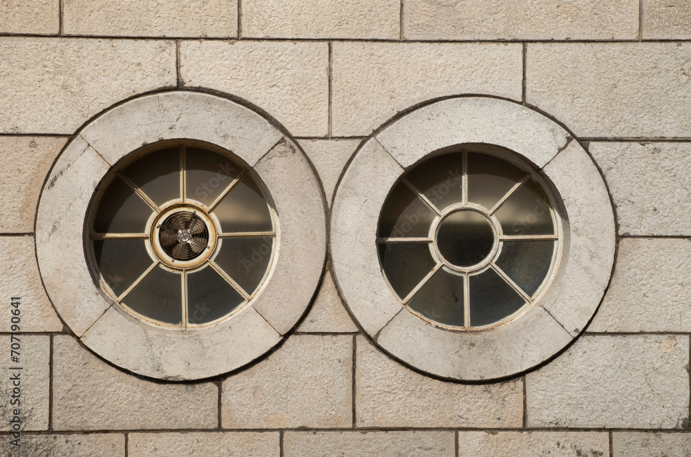 Two white round window on stone wall closeup in Montenegro, Europe
Two white round window on stone wall closeup in Montenegro, Europe