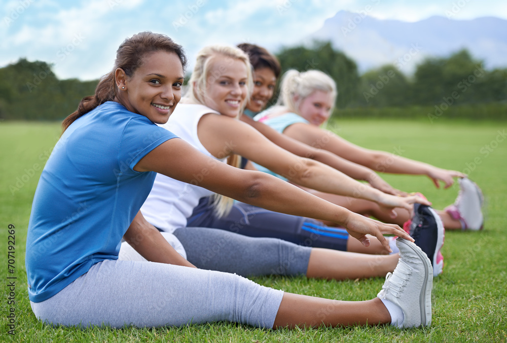 Women, stretching legs and fitness in park, sports field and nature with exercise for health and wellness. Athlete group warm up for workout, training together and portrait with smile outdoor Women, stretching legs and fitness in park, sports field and nature with exercise for health and wellness. Athlete group warm up for workout, training together and portrait with smile outdoor