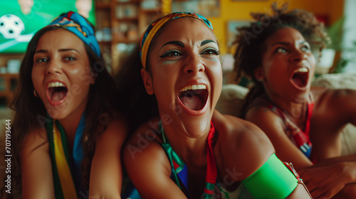 Excited Latina and Hispanic Women Enjoying European Soccer Match on TV - Passionate South American Soccer Fans, Intense Joy and Celebration, Close-Up View of Enthusiastic Supporters Watching Big Tourn
