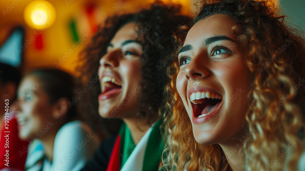 Excited Young Italian Women Soccer Fans Watching European Tournament Match on TV, Expressing Joy and Happiness in Intense Soccer Game Viewing Experience