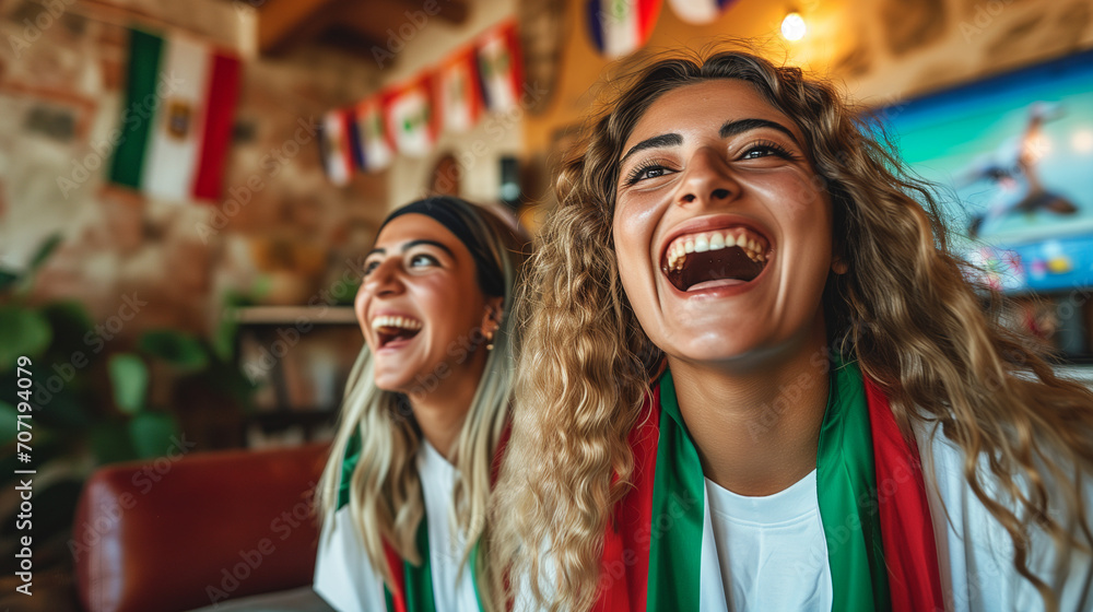 Excited Young Italian Women Soccer Fans Watching European Tournament Match on TV, Expressing Joy and Happiness in Intense Soccer Game Viewing Experience Excited Young Italian Women Soccer Fans Watching European Tournament Match on TV, Expressing Joy and Happiness in Intense Soccer Game Viewing Experience