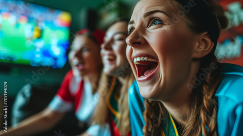 Excited Young German Women Soccer Fans Celebrating Victory Watching European Tournament Match on TV, Intense Happy Emotion in Living Room, Female Football Supporters Enjoying Game