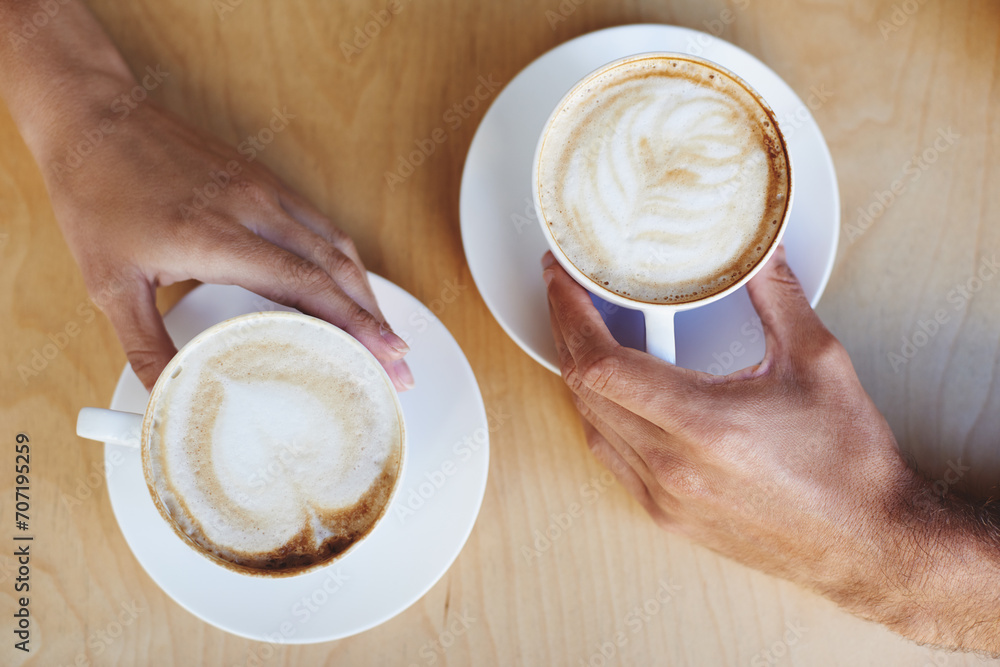 Top view, hands or couple in cafe with a coffee to relax with care, morning espresso or support. Closeup, date or people with tea, cappuccino or romance with love, peace or cup of tea in restaurant - obrazy, fototapety, plakaty 