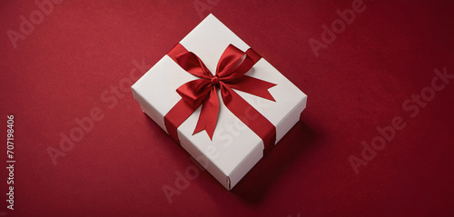 a christmas box, christmas present white with red bow