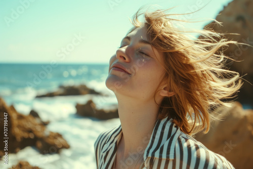 Woman Enjoying the Ocean Breeze for Well-being and Mindfulness Concept
