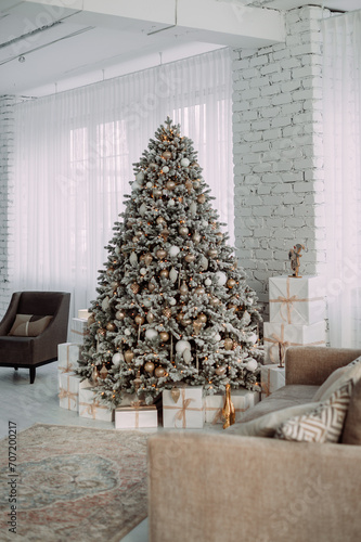 The image is of a Christmas tree with lights in a room. 5434 © alenazamotaeva