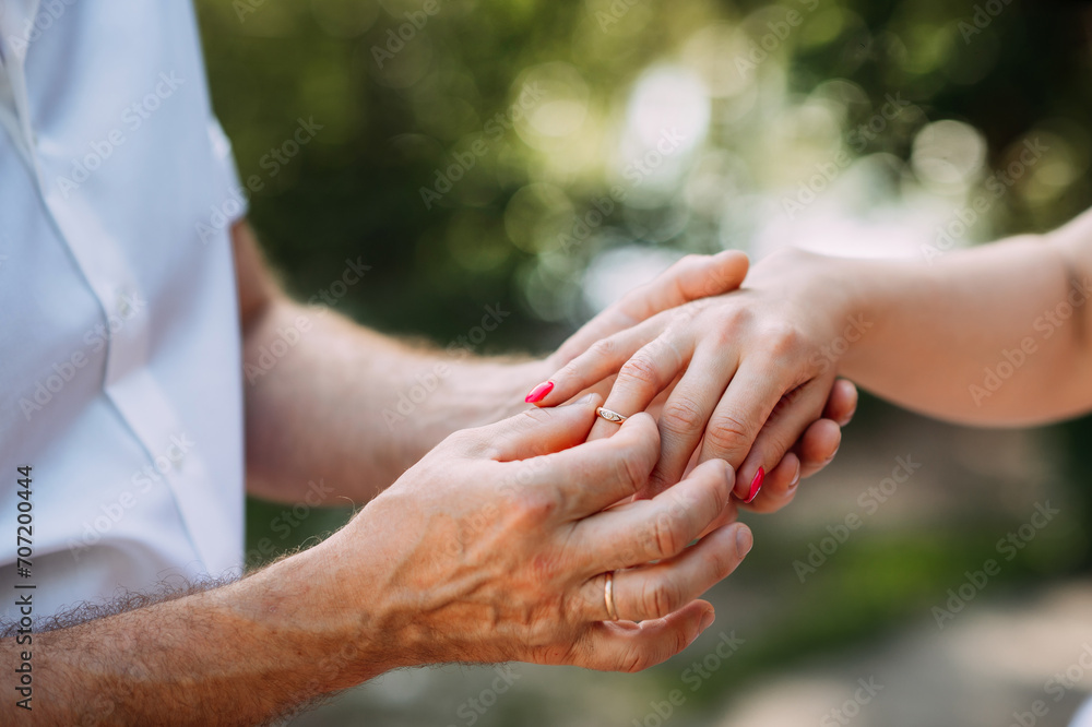 The image is a close-up of two hands shaking 5463. The image is a close-up of two hands shaking 5463.