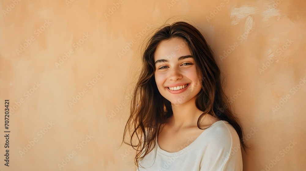 Beautiful young female model with brunette hair, pretty youthful teenage girl, smiling and looking at the camera, charming lady, wearing white t shirt