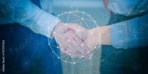 Fototapeta Naklejka Na Ścianę i Meble -  Financial background of businessman handshake in teamwork concept, HR recruitment and technology.
