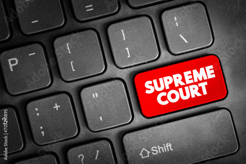 Supreme Court - highest court in the federal judiciary text button on keyboard, concept background
