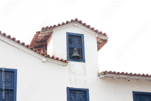 Historic church bell in Embu das artes photo