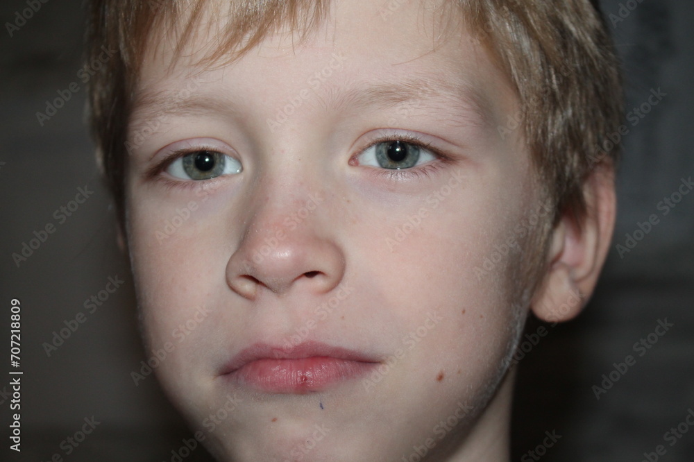 Happy young caucasian boy looking at camera, closeup Happy young caucasian boy looking at camera, closeup