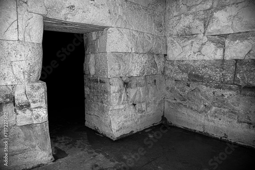 Old stone ruins inside. Stone halls and rooms of an old palace or dungeon.