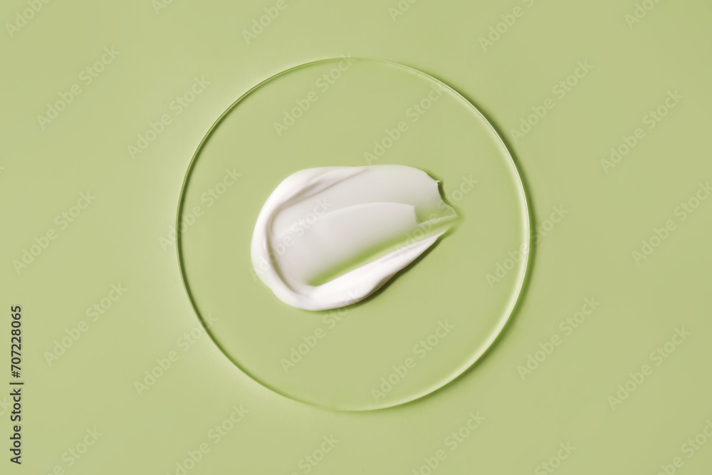A savory smear of white cream on a green background. A savory smear of white cream on a green background.