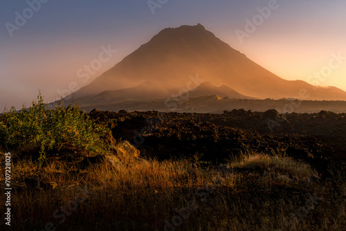 The Pico do Fogo volcano and the lava field at the foggy beautiful sunset at Fogo island, Cape Verde. photo
