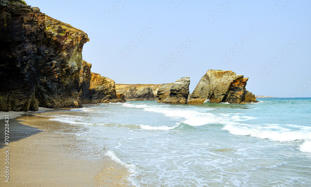 Las Catedrales beach is the tourist name for Aguas Santas beach, located in the Galician municipality of Ribadeo, on the coast of the province of Lugo, Spain, on the Cantabrian Sea.

