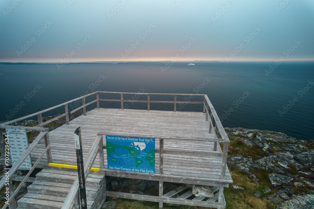 The platform atop Brimstone Head considered one of the four corners of the world as seen from an aerial drone view with the North Atlantic and icebergs in the background