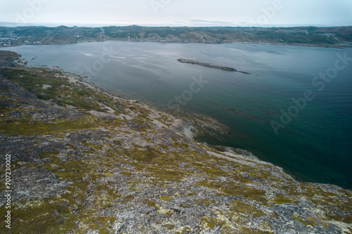 The view from atop Brimstone Head looking back into the harbor considered one of the four corners of the world as seen from an aerial drone view with Seal cove and Sunker Island