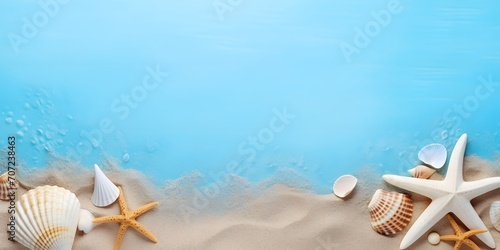 Seashell, starfish and beach sand on blue background. Summer holiday concept. Top view and flat lay.