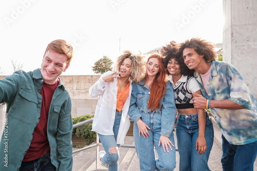 Selfie of group of young friends outdoors on university campus. Concept: Lifestyle, together