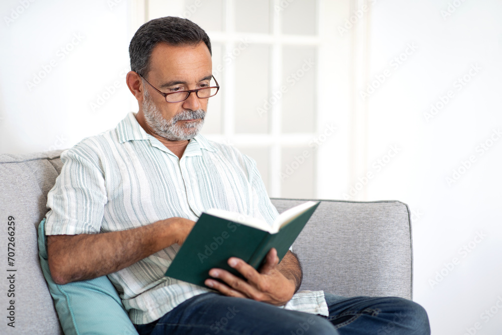 Mature Man Resting With Book Enjoying Peaceful Reading At Home Mature Man Resting With Book Enjoying Peaceful Reading At Home