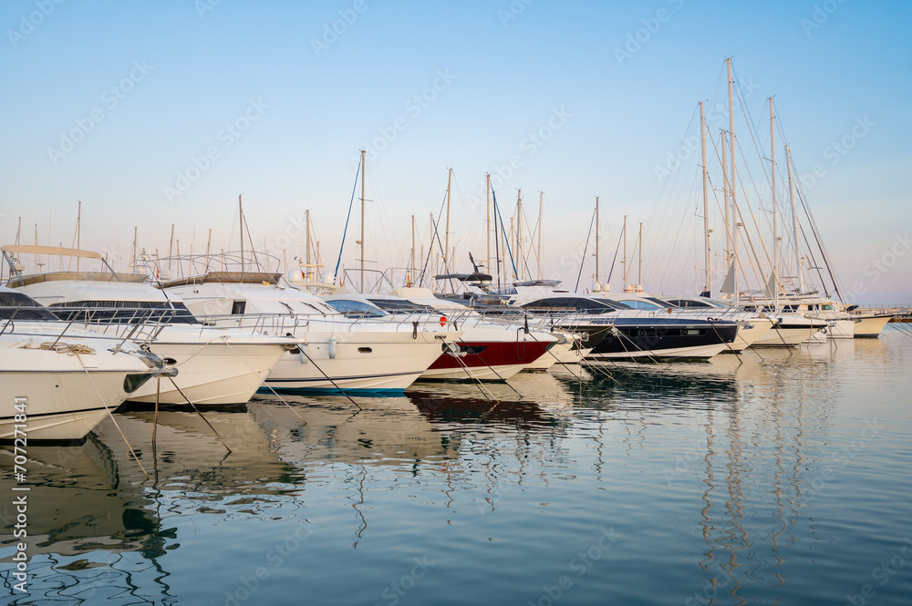 Scenic view of Yatchs moored at Cambrils dock at sunset, Catalonia, Spain. High quality photo