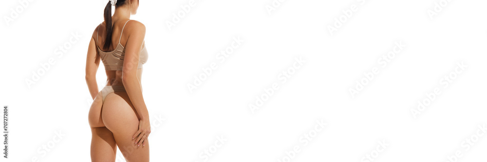 Fototapeta premium Cropped image of slim. fit female body, buttocks in underwear against white studio background. Anti-cellulite massage, care. Concept of natural beauty, health and body care, sport, spa, diet. Banner