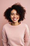 Beautiful african american woman smiling at camera isolated on pink