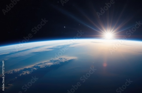 The edge of planet Earth on the background of space in the rising rays of the sun