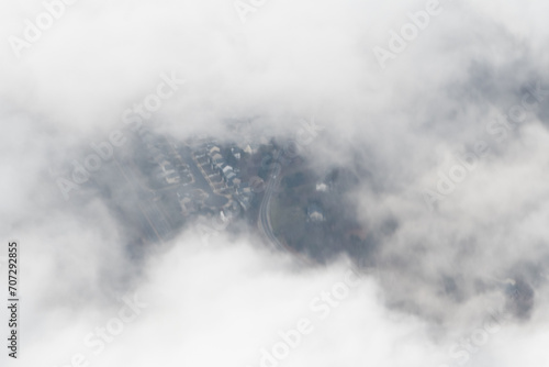 Aerial photograph of suburban areas of Washington DC as seen through clouds from my airplane window photo