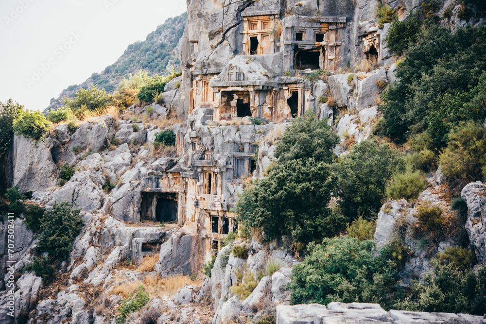 Archeological remains of the Lycian rock cut tombs in Myra, Demre, Turkey.