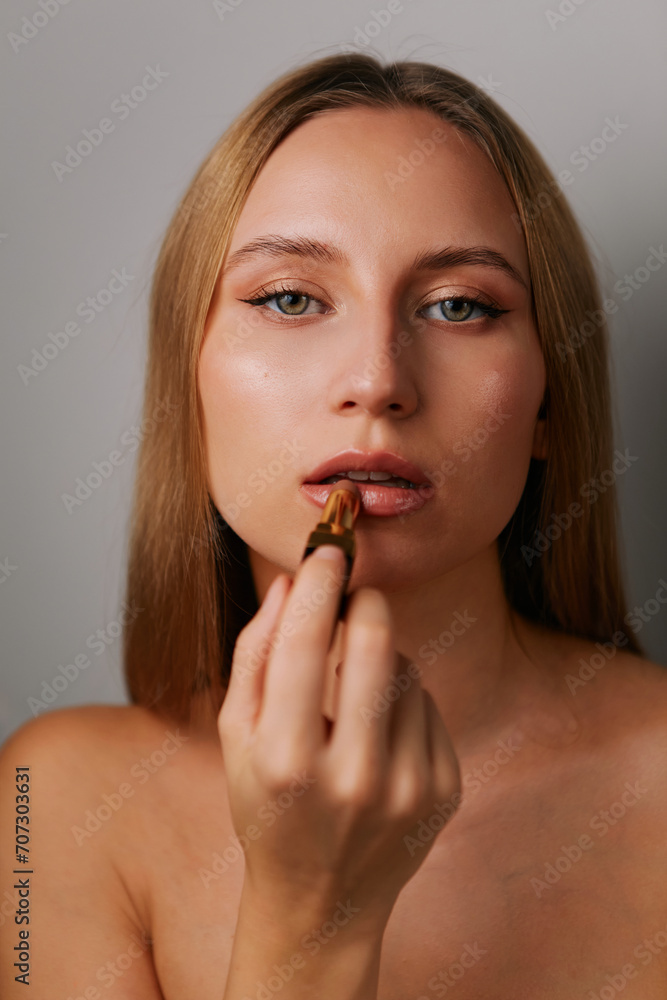 Minimalistic beauty portrait of a beautiful girl with makeup and emotions on a light background Minimalistic beauty portrait of a beautiful girl with makeup and emotions on a light background