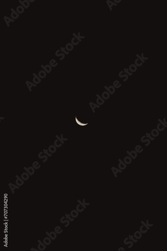 crescent moon landscape in dark sky