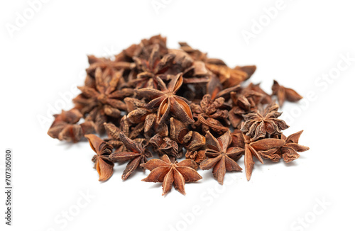 Anise seed stars on a white background.