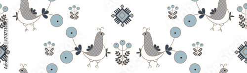 Seamless pattern with fantastic stylised birds based on Ukrainian traditional folkart - Naddniprianska embroidery. The pattern depicts birds, solar symbols, floral elements. photo