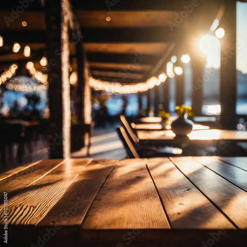 Wooden table blurred background of restaurant of cafe with bokeh.