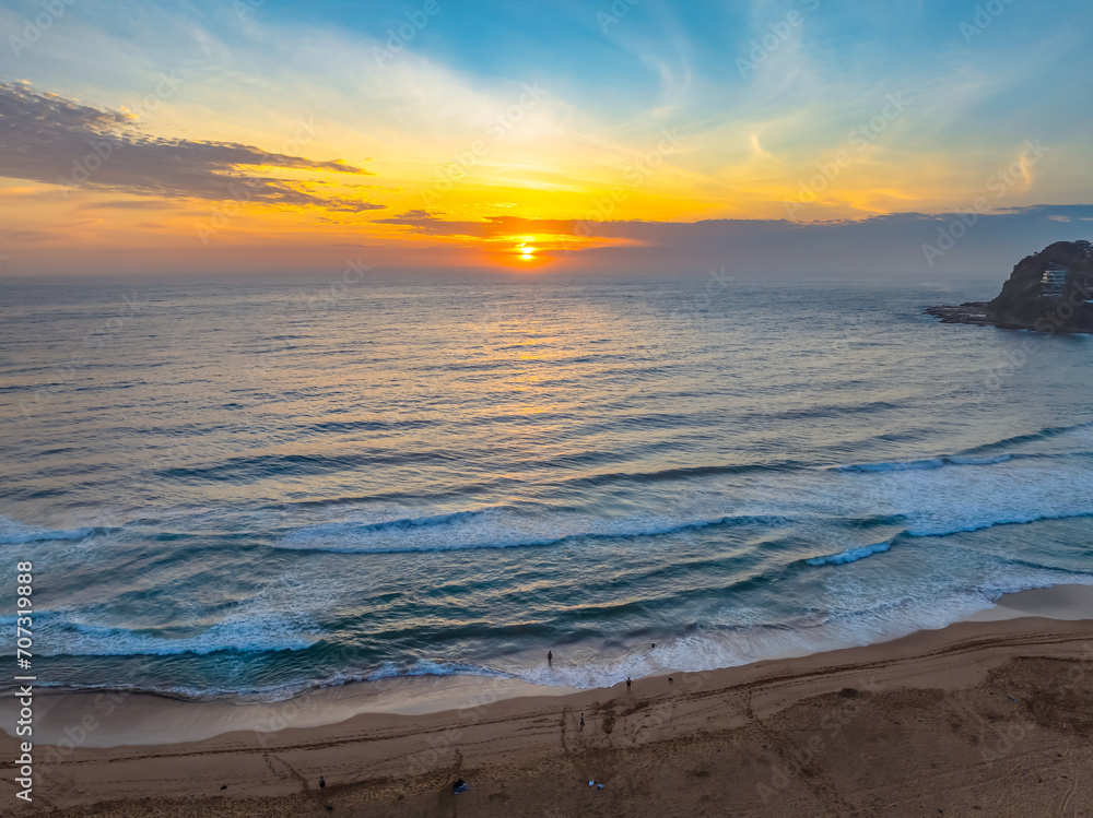 Fototapeta premium Hazy Summer Sunrise at the seaside with high cloud