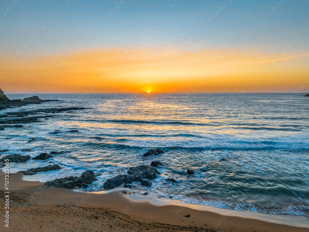 Sunrise seascape with high clouds