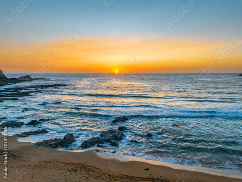 Sunrise seascape with high clouds