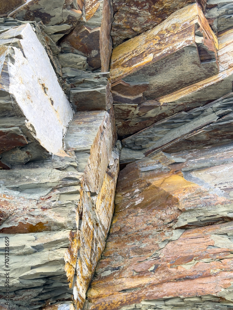 Natural, abstract rock formations with cracks, layers and textures Natural, abstract rock formations with cracks, layers and textures