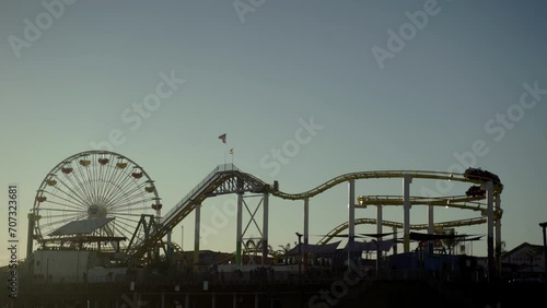 Zoom shot of Roller coaster on the Santa Monica pier during sunset