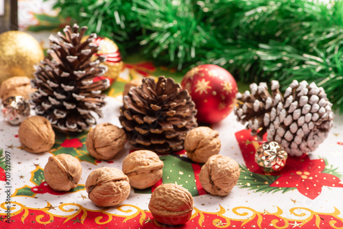 Christmas table, a beautiful table with nuts and christmas accessories, selective focus.