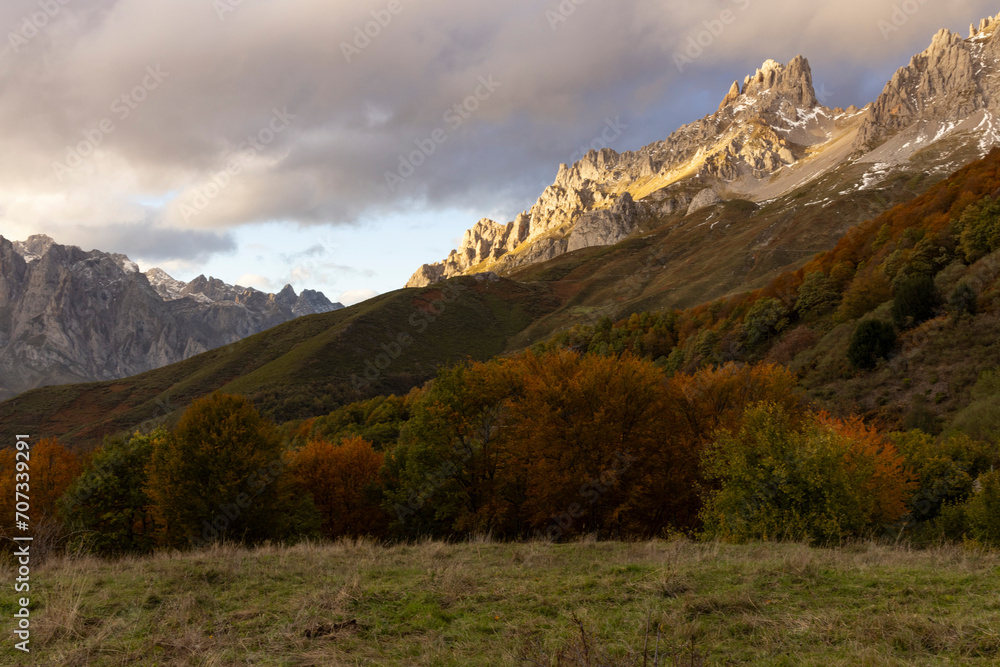 Peaks of Europe national park in northern Spain Cantabrian mountains during autumn at sunset with bright colorful leaves