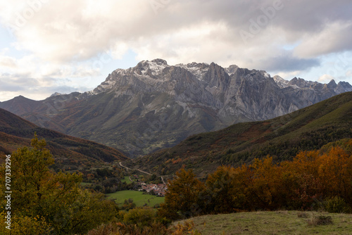 Peaks of Europe national park in northern Spain Cantabrian mountains during autumn at sunset with bright colorful leaves