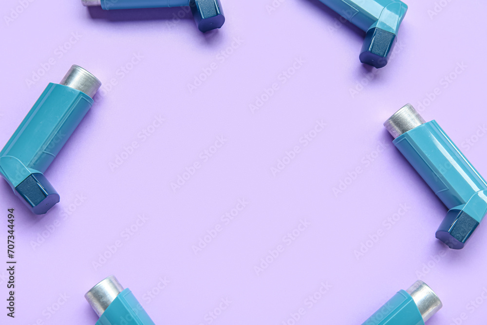 Frame made of asthma inhalers on lilac background Frame made of asthma inhalers on lilac background