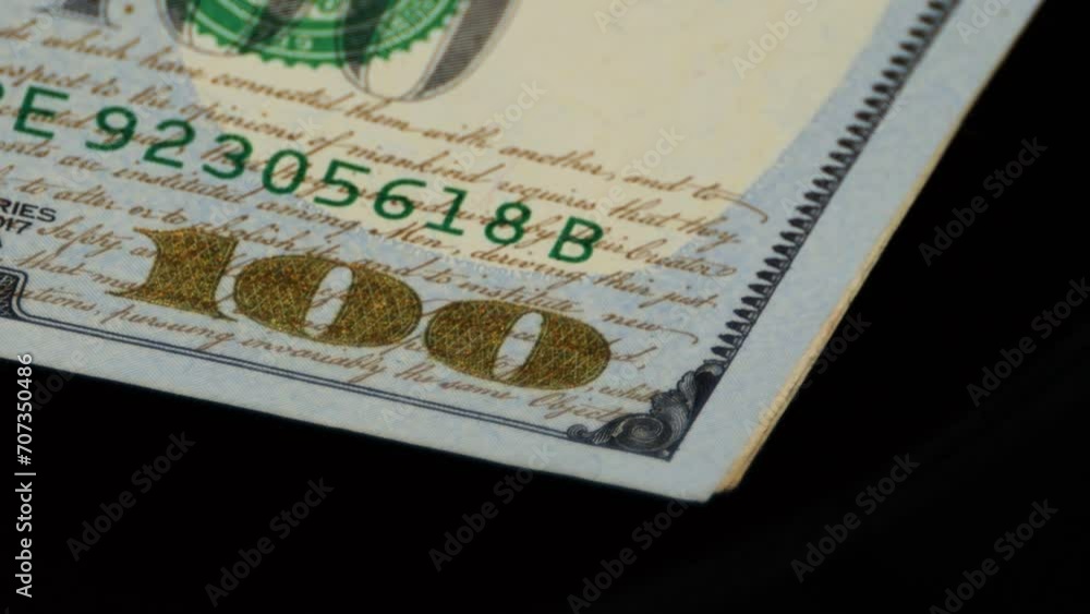 Closeup of The US Dollar bill's security feature, denomination printed with Color Shifting ink for better identification. Closeup of The US Dollar bill's security feature, denomination printed with Color Shifting ink for better identification.