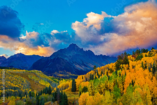 Mount Sneffels in Colorado with fall colored aspen trees at dawn photo