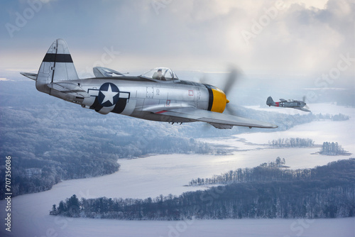 P-47 Thunderbolt chases a Focke-Wulf 190 (models) over a winter landscape photo